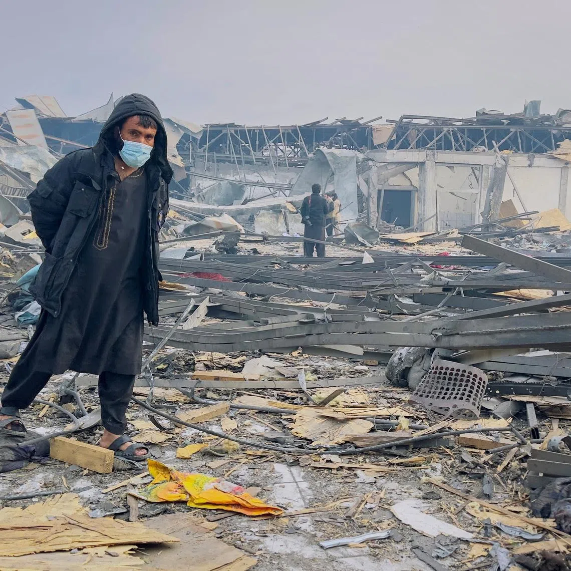 A man walks at the site of a drug users rehabilitation hospital destroyed in what the Taliban said was a Pakistani air strike in Kabul, Afghanistan, March 17, 2026. REUTERS/Sayed Hassib