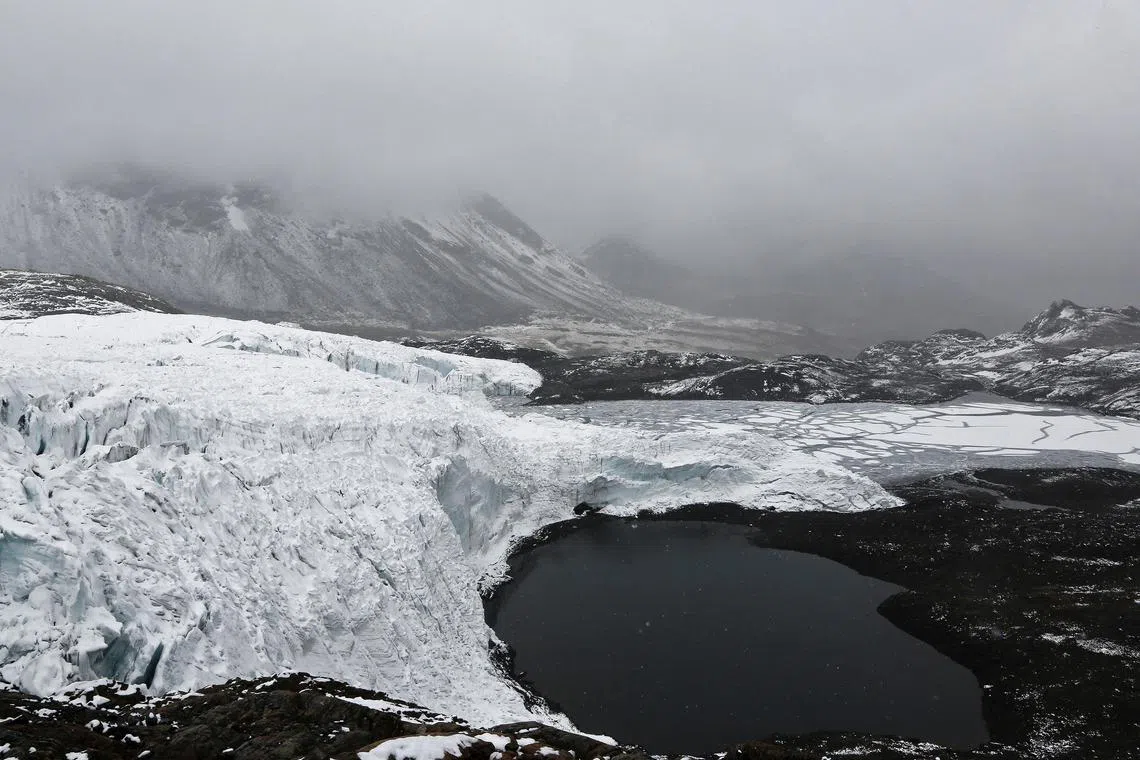 FILE PHOTO: A view of the lake formed by meltwater from the Pastoruri glacier, as seen from atop the glacier in Huaraz, September 19, 2013. Picture taken September 19, 2013. REUTERS/Mariana Bazo/File Photo