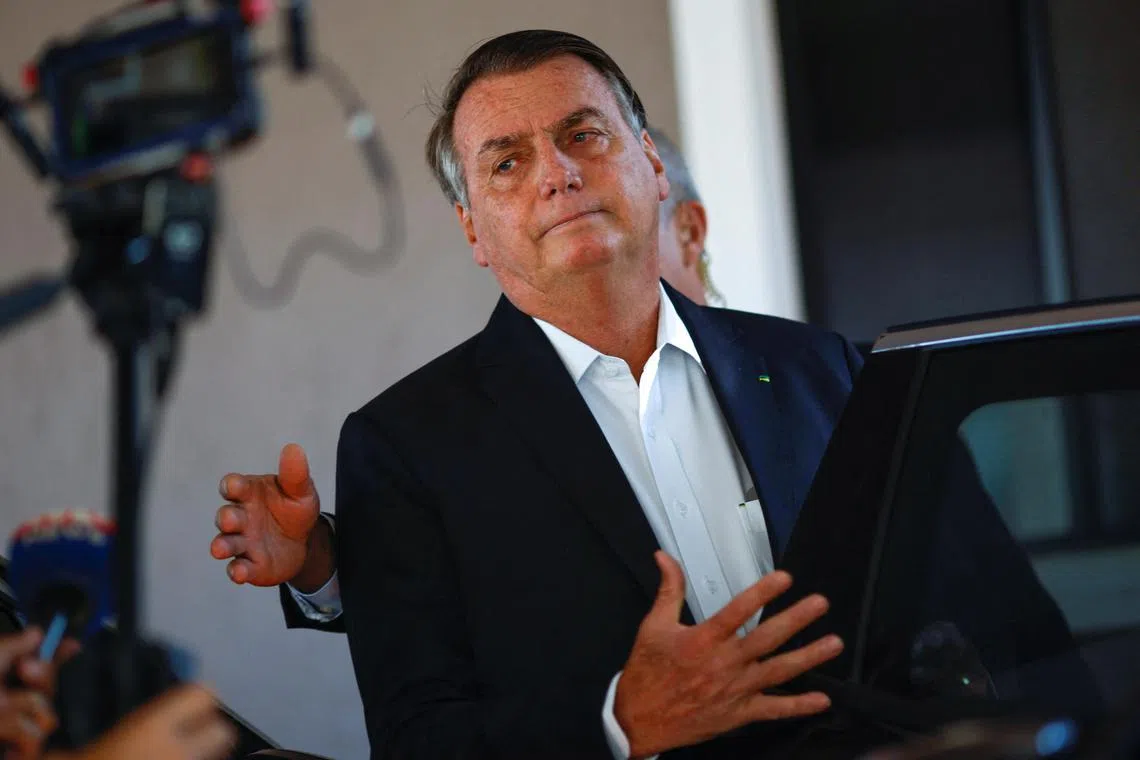 Former Brazilian president Jair Bolsonaro leaves his home following the police search operation, in Brasilia.