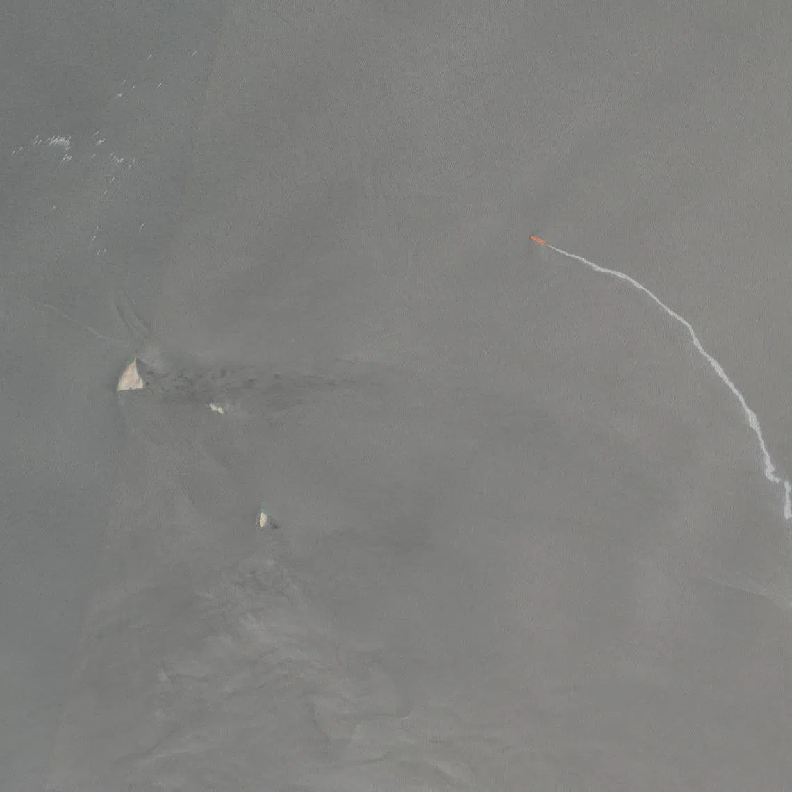 A satellite image shows a white streak trailing from a vessel identified by TankerTrackers.com as the M.V. Barakah, in the Strait of Hormuz, near Musandam Province, Oman, May 9, 2026. European Union/Copernicus Sentinel-2/Handout via REUTERS THIS IMAGE HAS BEEN SUPPLIED BY A THIRD PARTY. MANDATORY CREDIT