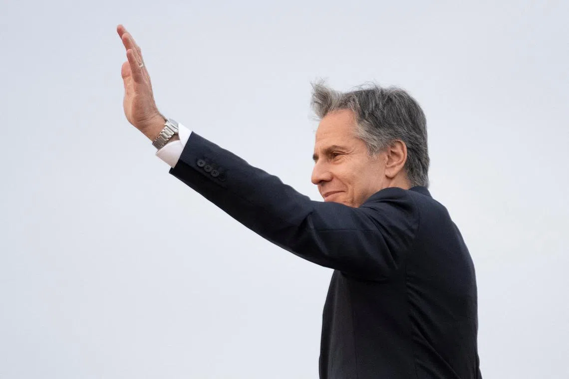 FILE PHOTO: U.S. Secretary of State Antony Blinken waves as he boards his plane at Yokota Air Base in Fussa, on the outskirts of Tokyo, Japan Tuesday, April 18, 2023, to travel back to Washington. Blinken is concluding a trip to Ireland, Vietnam, and Japan.     Andrew Harnik/Pool via REUTERS/File Photo