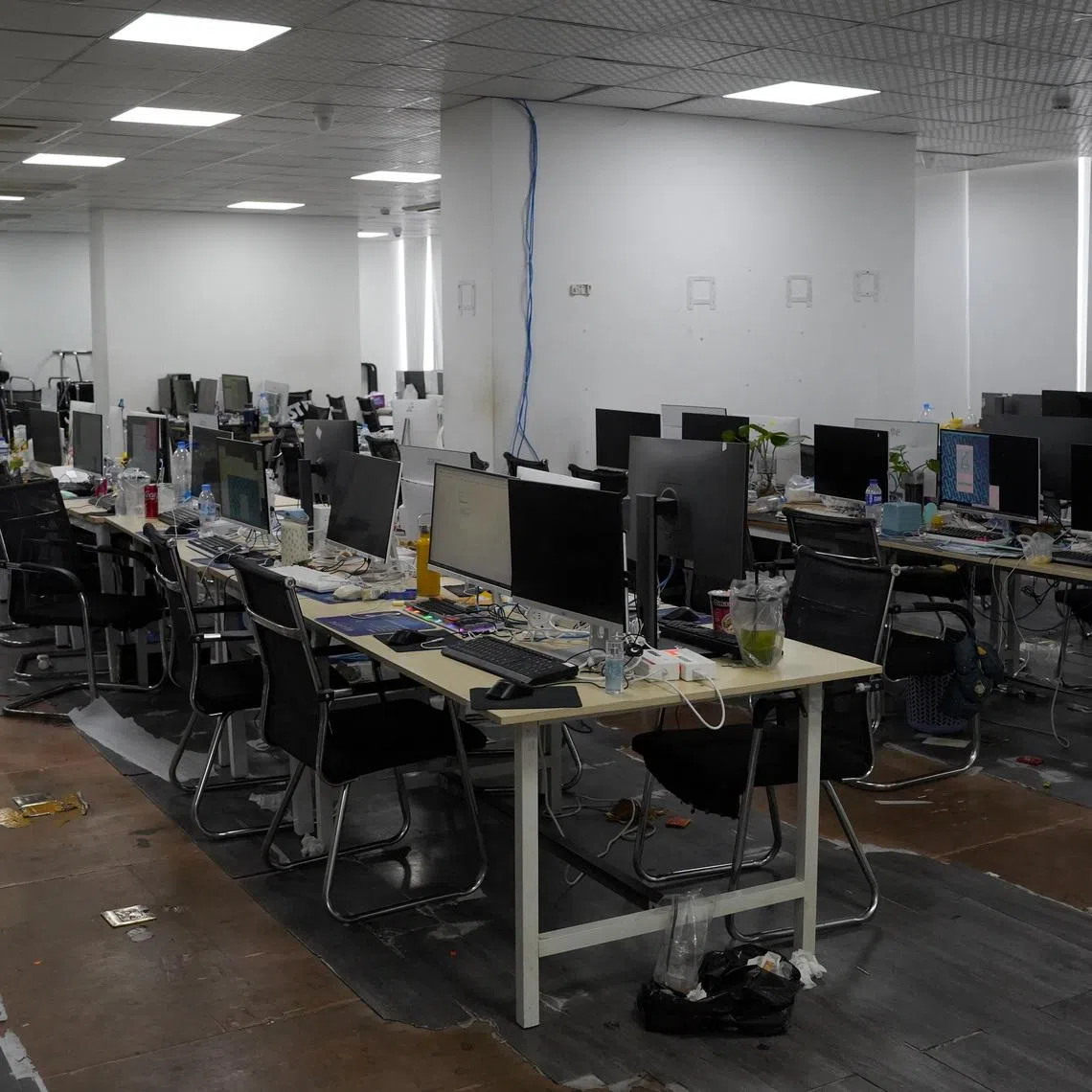 Computers and workstations seized by police during an online scam crackdown at a hotel in Phnom Penh, Cambodia, March 11, 2026. REUTERS/Roun Ry