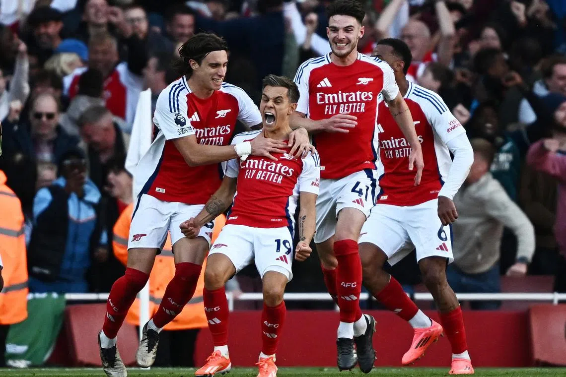 Arsenal forward Leandro Trossard wheeling away in joy after his goal in injury time sends his team towards a 4-2 victory over Leicester City in the English Premier League at the Emirates on Sept 28. 