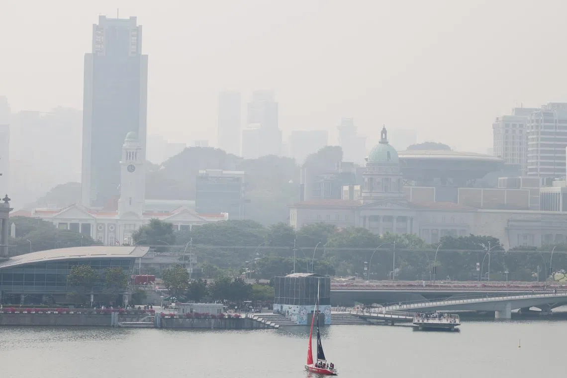 Hazy conditions in the civic district (foreground) and central Singapore (background) at around 4pm on Oct 7. The 24-hour PSI as of 3pm in the central district was 107.