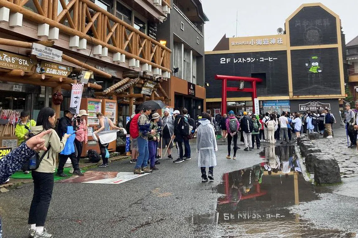 Visitors are seen at the fifth stage on the slopes of Mount Fuji, Japan's highest mountain 3,776 metres (12,388 ft), in Fujiyoshida, Japan, September 9, 2023. REUTERS/Mariko Katsumura