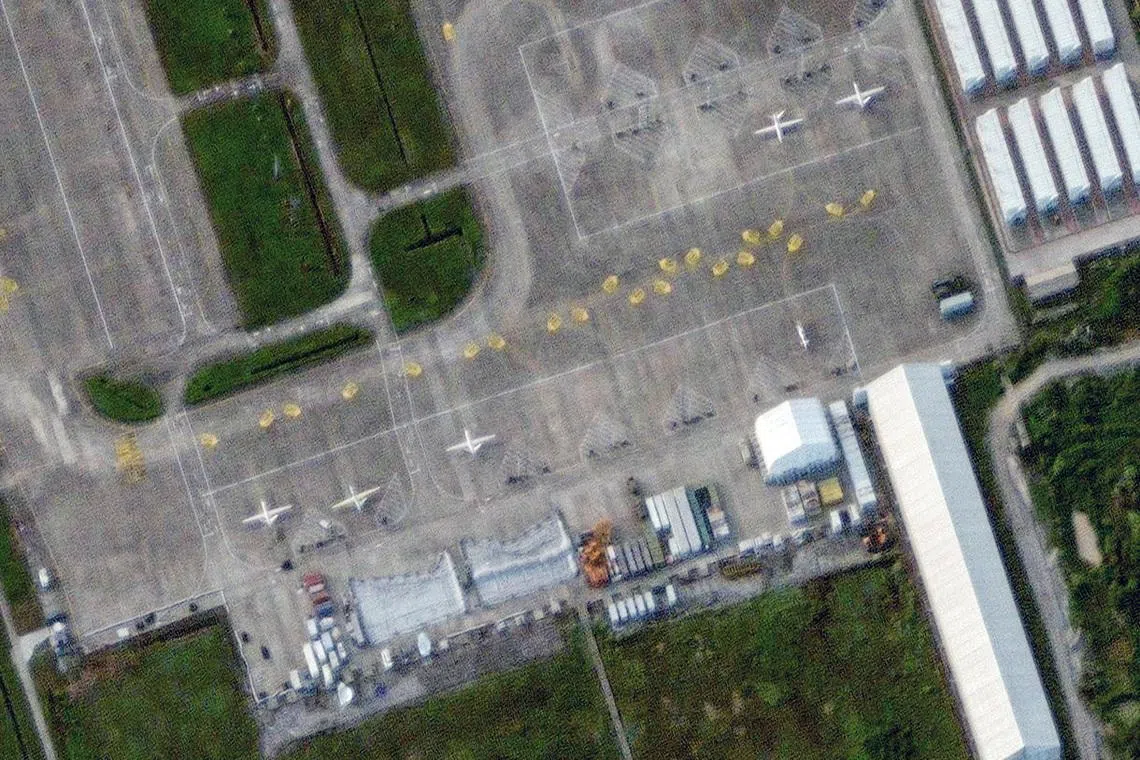 A satellite image shows large drones at Qionghai Boao International Airport on Hainan Island, China, September 3, 2025.    VANTOR/Handout via REUTERS