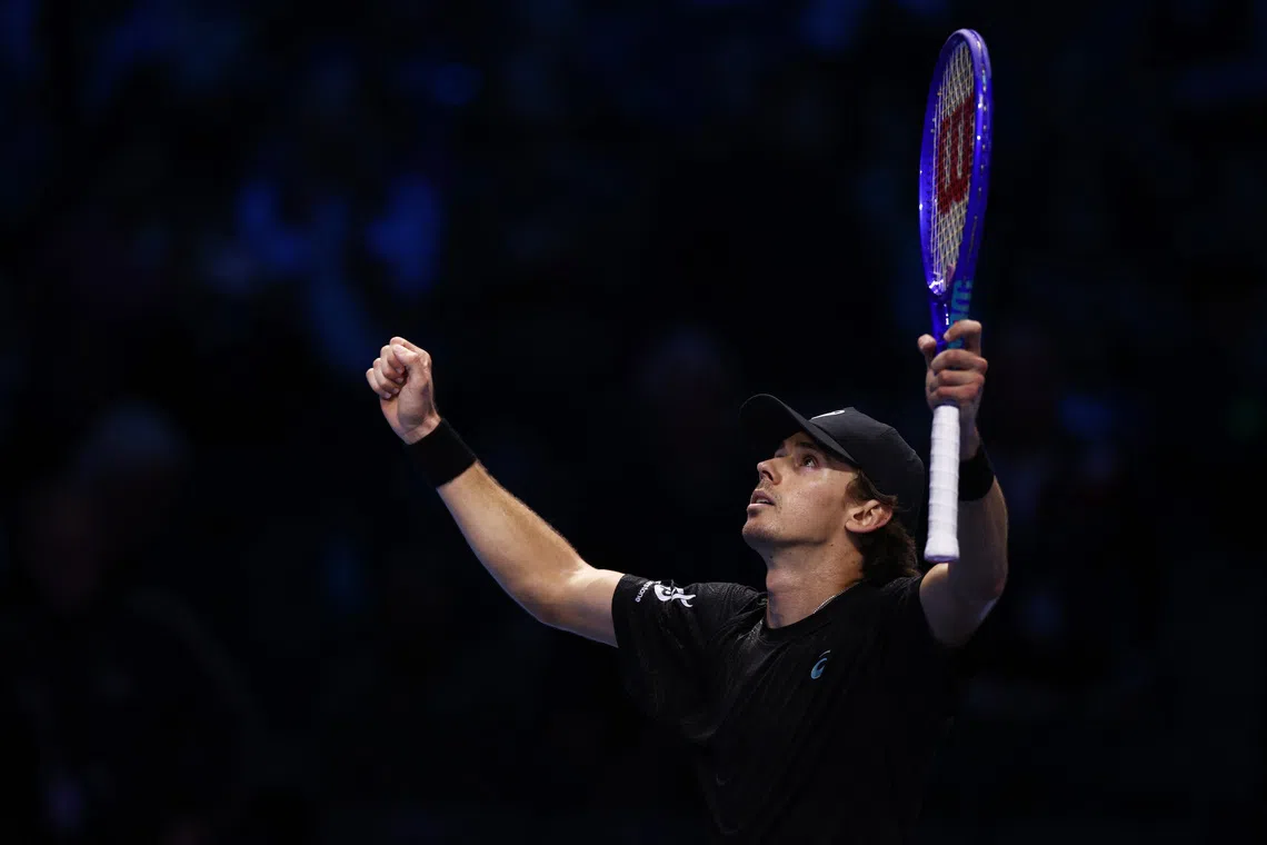 Tennis - ATP Finals - Turin - Palasport Olimpico, Turin, Italy - November 13, 2025 Australia's Alex de Minaur celebrates winning his group stage match against Taylor Fritz of the U.S. REUTERS/Guglielmo Mangiapane