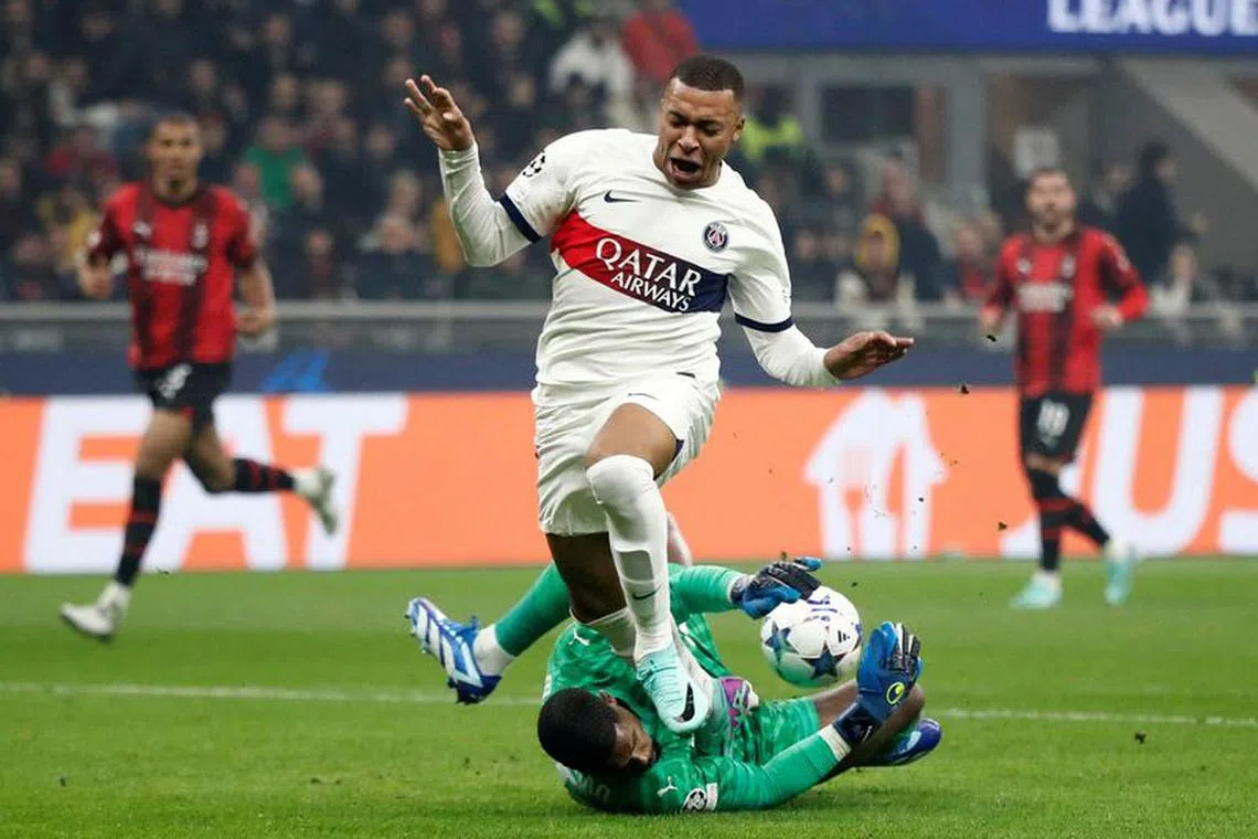 Soccer Football - Champions League - Group F - AC Milan v Paris St Germain - San Siro, Milan, Italy - November 7, 2023 Paris St Germain's Kylian Mbappe in action with AC Milan's Mike Maignan REUTERS/Alessandro Garofalo /file photo