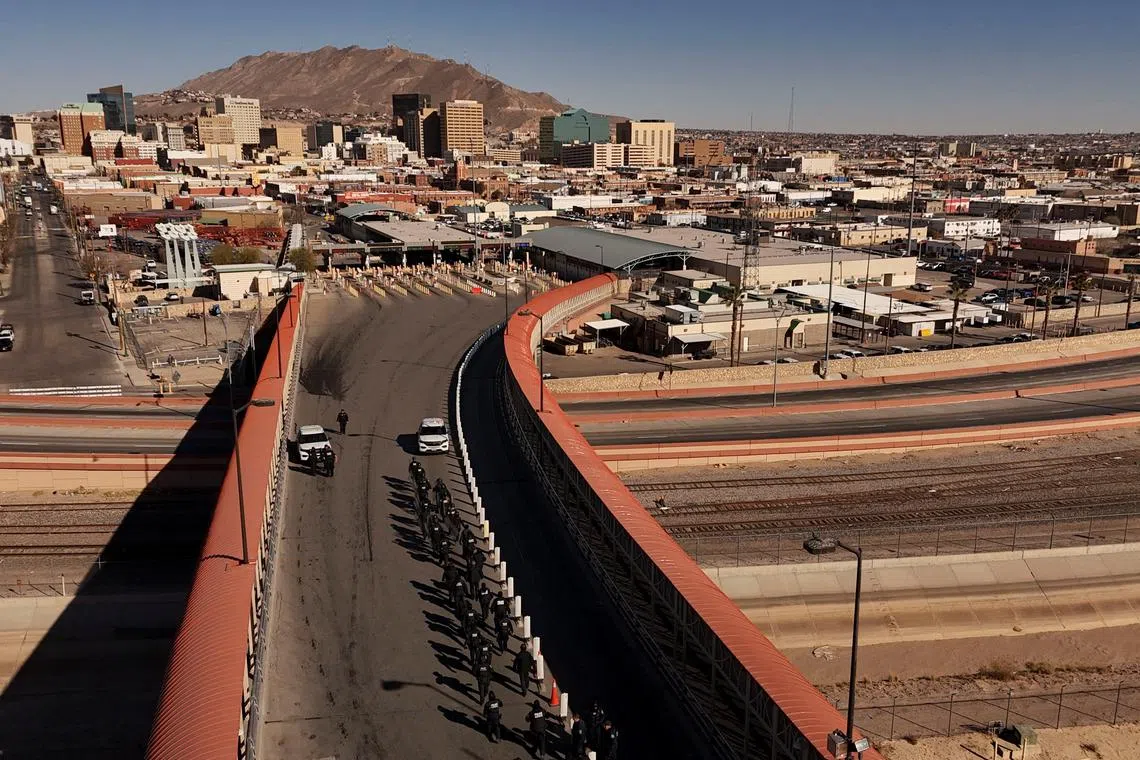 Members of U.S. Customs and Border Protection (CBP) perform a drill at the Paso del Norte International border bridge, in this drone picture, as seen from Ciudad Juarez, Mexico January 23, 2025. REUTERS/Jose Luis Gonzalez