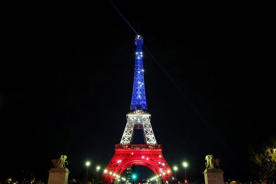 The Eiffel Tower illuminated in the colours of the French flag on Nov 12, ahead of the 10th anniversary of the Nov 13 terrorist attacks in Paris.