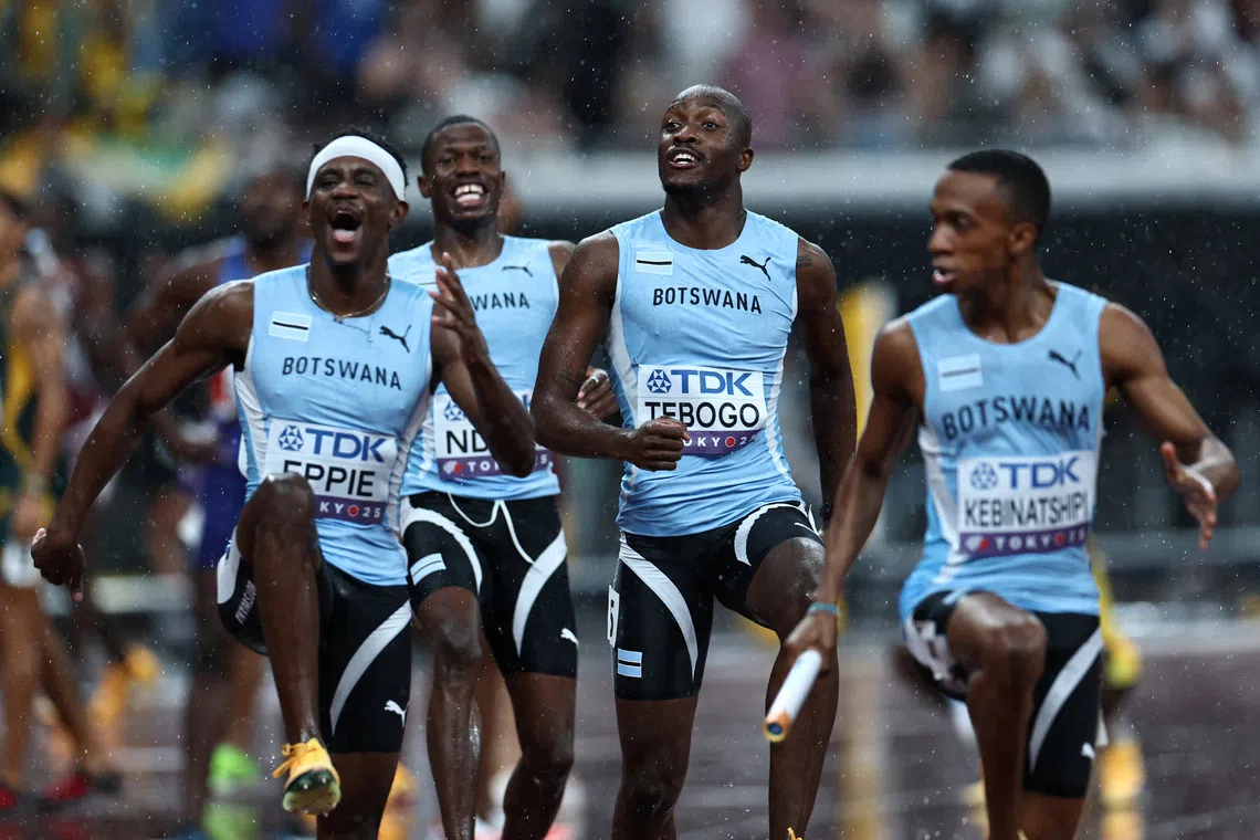 World Athletics Championships Tokyo 2025 - Men's 4 x 400m Relay Final - Japan National Stadium, Tokyo, Japan - September 21, 2025 Botswana's Lee Bhekempilo Eppie, Letsile Tebogo, Bayapo Ndori, and Busang Collen Kebinatshipi celebrate after winning gold REUTERS/Eloisa Lopez