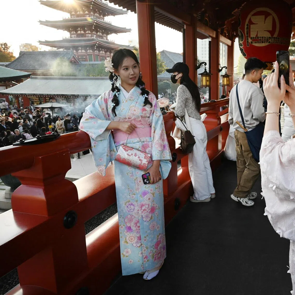 Chinese tourists wear kimonos as they visit the Sensoji Temple in the Asakusa district of Tokyo on Nov 15.