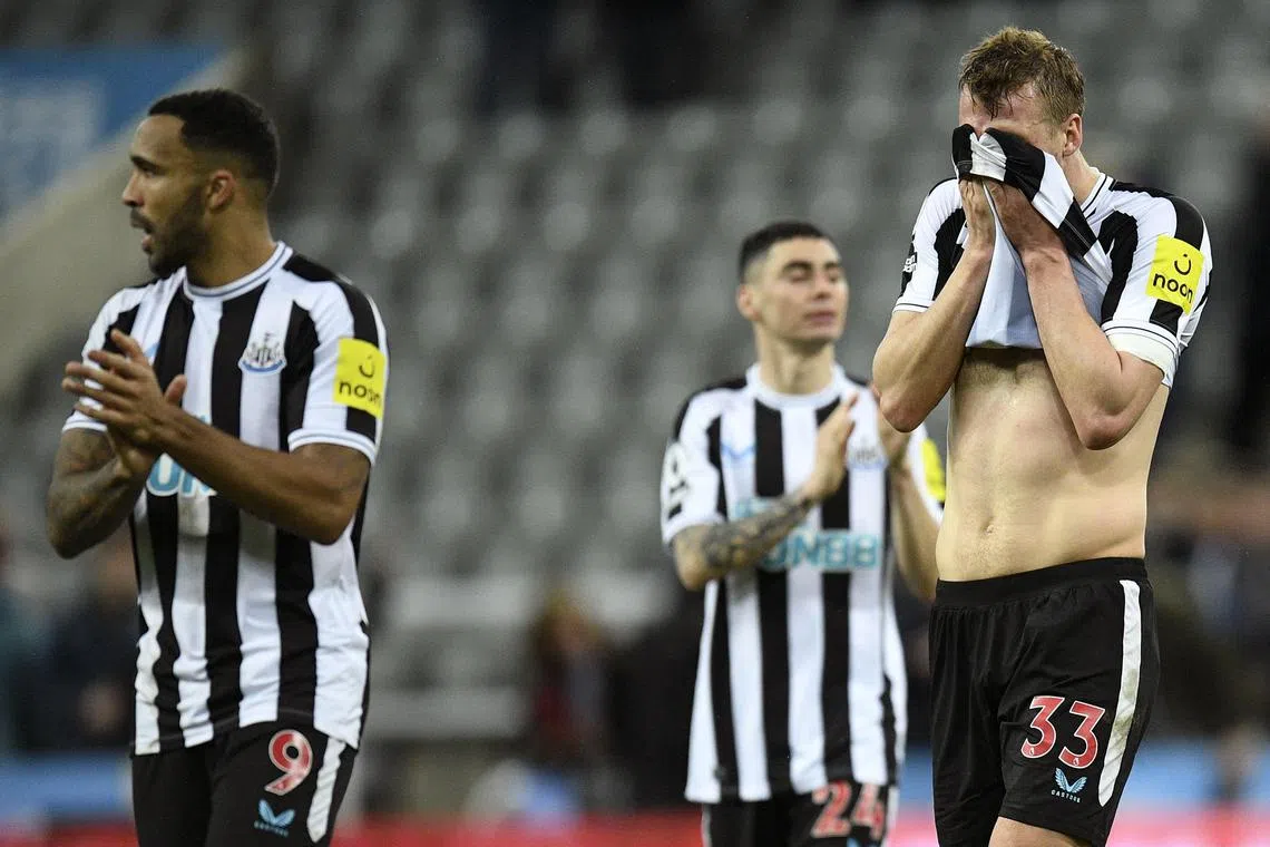 Newcastle United's Callum Wilson (left) and Dan Burn (right) react at the end of the match.