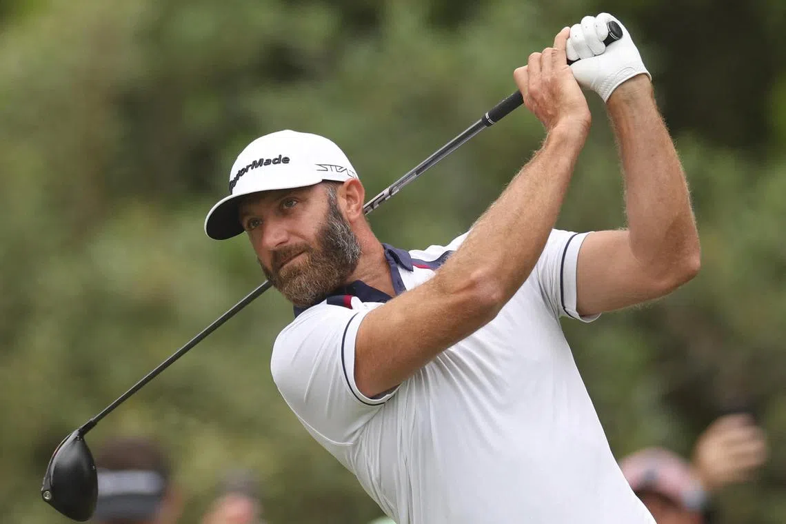 Dustin Johnson plays his shot from the second tee during the second round.