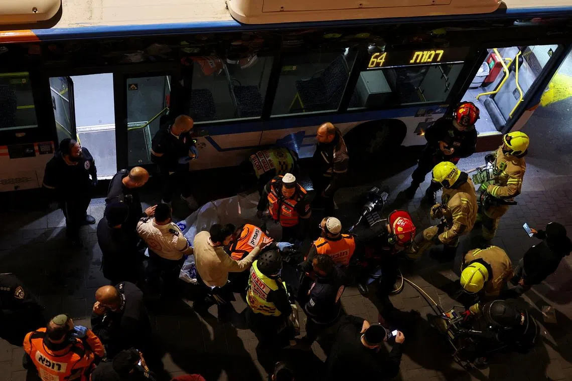 Emergency responders attend the scene of where, according to Israel's ambulance service, a man was killed in a collision involving a bus and several pedestrians, during a protest by Ultra-Orthodox Jewish men against pressure to conscript men from their community into Israel's military, in Jerusalem, January 6, 2026. REUTERS/Ammar Awad