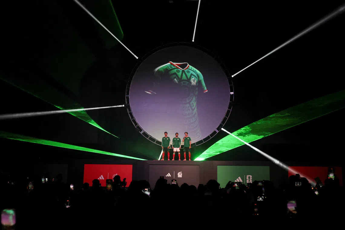 Players of the Mexican national football team, Henry Martin, Ramon Juarez and Marcel Ruiz pose with the Mexico national team's new jersey during an event by Adidas, ahead of the 2026 World Cup, in Mexico City, Mexico, November 5, 2025. REUTERS/Henry Romero