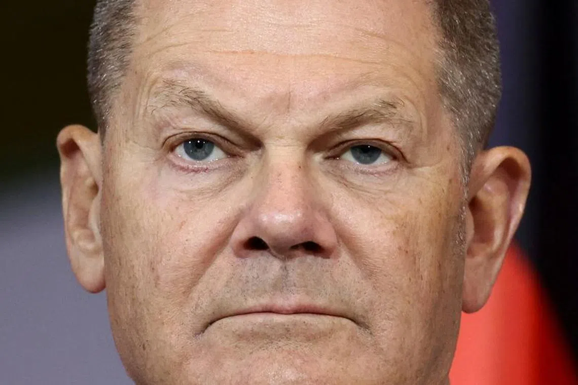 German Chancellor Olaf Scholz looks on next to Luxembourg Prime Minister Luc Frieden (not pictured) as they address the media at the Chancellery in Berlin, Germany, January 8, 2024. REUTERS/Liesa Johannssen