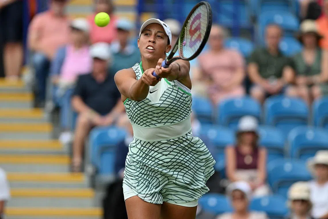 Madison Keys returns the ball to Coco Gauff during their Eastbourne International semi-finals.