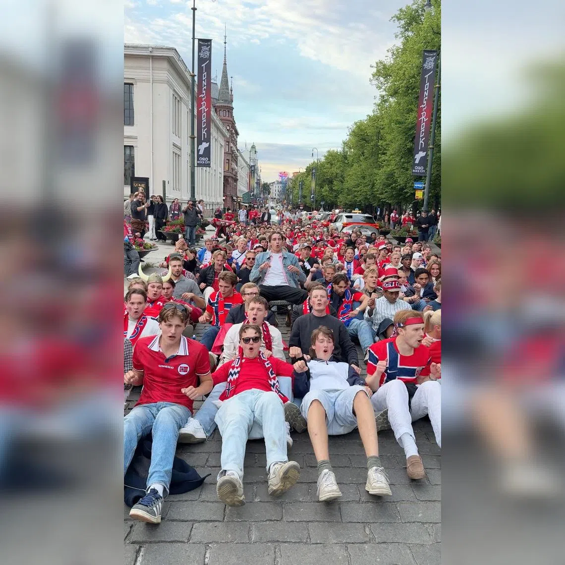 Supporters of the Norwegian football team perform the “Viking Row” on a street after their team’s Group I victory over Senegal, in Oslo, Norway June 23, 2026, in this screengrab obtained from a social media video. Martin Giaever/Fotballfesten/via REUTERS THIS IMAGE HAS BEEN SUPPLIED BY A THIRD PARTY. MANDATORY CREDIT. NO RESALES. NO ARCHIVES. VERIFICATION: - Buildings, pavement and trees matched satellite and archive imagery - Date verified by metadata on original video files