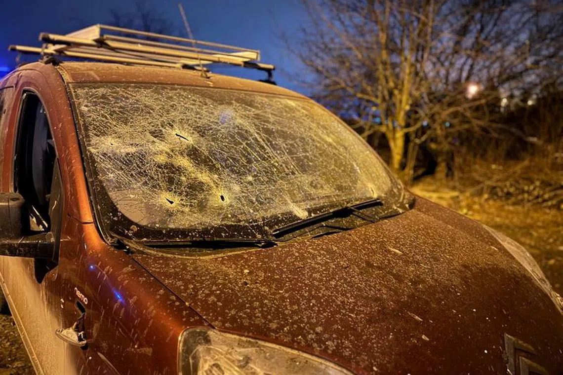A view shows a damaged car following what was said to be Ukrainian forces' shelling in the course of Russia-Ukraine conflict, in Belgorod, Russia, in this picture released December 30, 2023. Governor of Russia's Belgorod Region Vyacheslav Gladkov via Telegram/Handout via REUTERS
