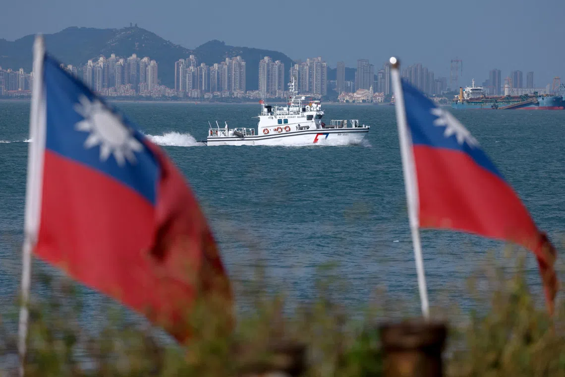 A Taiwan Coast Guard ship patrols near Dadan Island as China's Xiamen is visible in the background, on Dadan Island, in Kinmen, Taiwan, October 18, 2025. REUTERS/Ann Wang