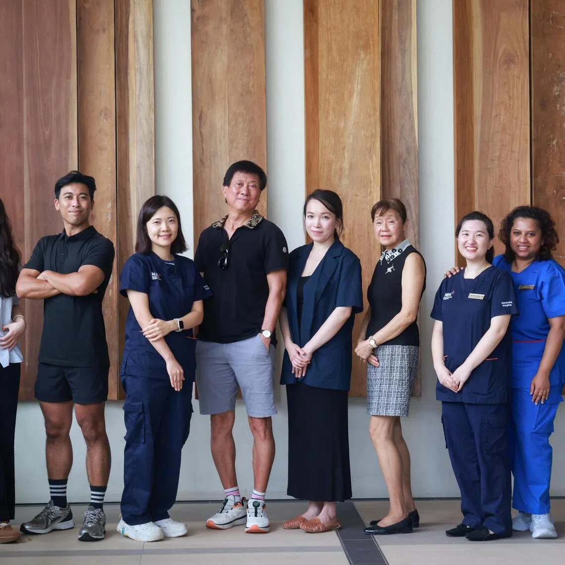 The team members at Alexandra Hospital’s Healthy Longevity Research Clinic (HLRC) with some participants (from left): research assistant He Qian; exercise physiologist Saiful Anwar; Michelle Liao, a doctor; participant Ivan Low; Laureen Wang, head of HLRC; participant Lee Siu Yin; Grace Chiang, a family medicine consultant with HLRC; senior staff nurse Eswari Sundrasagaran; and health coach Cheryl Tan.