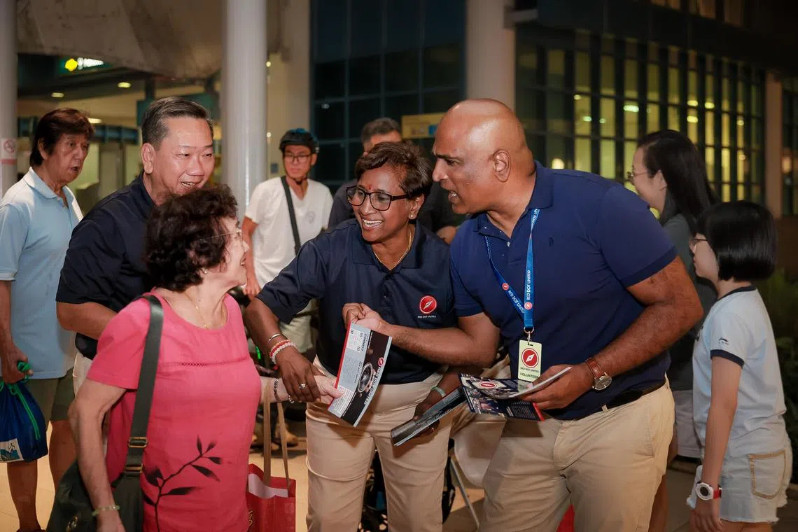 sajk21
Red Dot United (RDU) party lead for Jalan Kayu Single Member Constituency (SMC) Kalayarasu Manickam (2nd from right) and volunteer Ravi Madasamy, better known as M. Ravi (right), greeting residents at Fernvale LRT Station within the Jalan Kayu Single Member Constituency (SMC) on March 21, 2025.