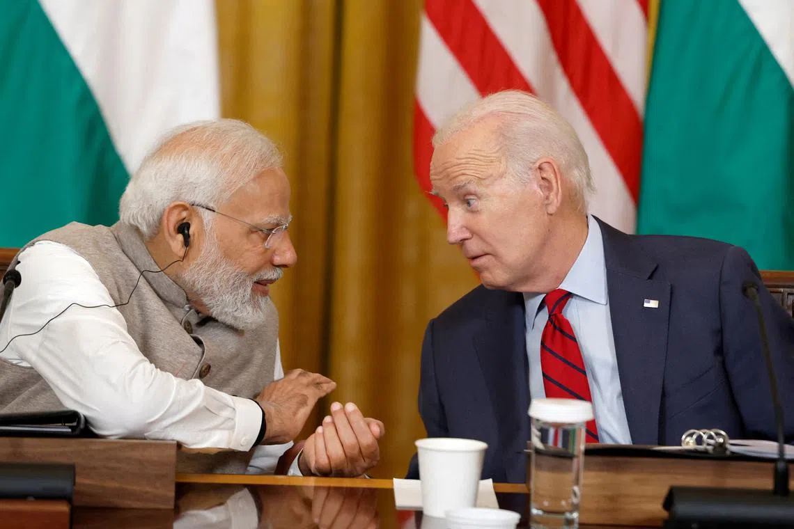 FILE PHOTO: U.S. President Joe Biden and India's Prime Minister Narendra Modi meet with senior officials and CEOs of American and Indian companies in the East Room of the White House in Washington, U.S., June 23, 2023. REUTERS/Evelyn Hockstein/File Photo