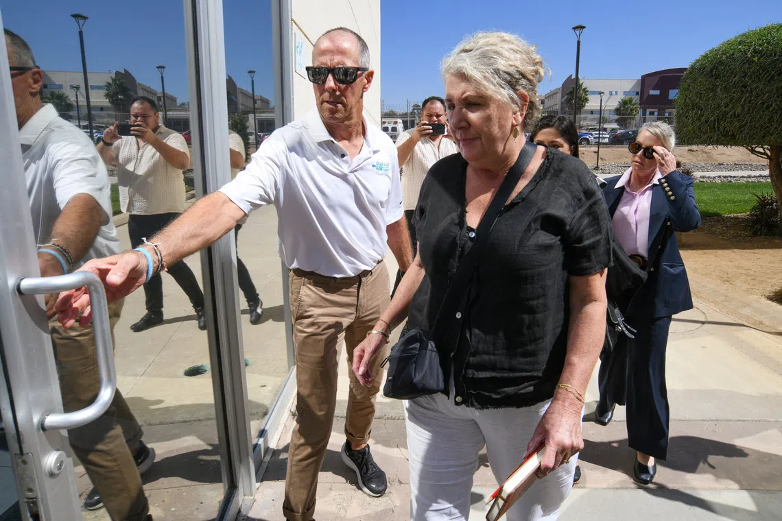 Martin and Debra Robinson, parents of Australian brothers Callum and Jake Robinson, who were killed during a surfing trip in April 2024, arrive at the Baja California State Palace of Justice for closing arguments in the trial of three men accused of murdering the brothers and their US friend Carter Rhoad, in Ensenada, Mexico, October 8, 2026. REUTERS/Enrique Botello