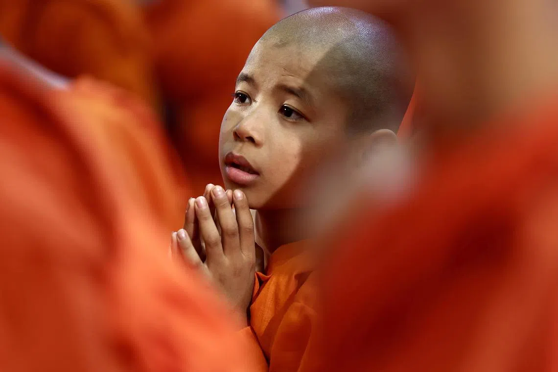 A Buddhist monk prays during the Buddha Jayanti, or Buddha Purnima, also known as Vesak Day, celebrations organized by the Maha Bodhi Society in Bangalore, India, on May 12, 2025. 