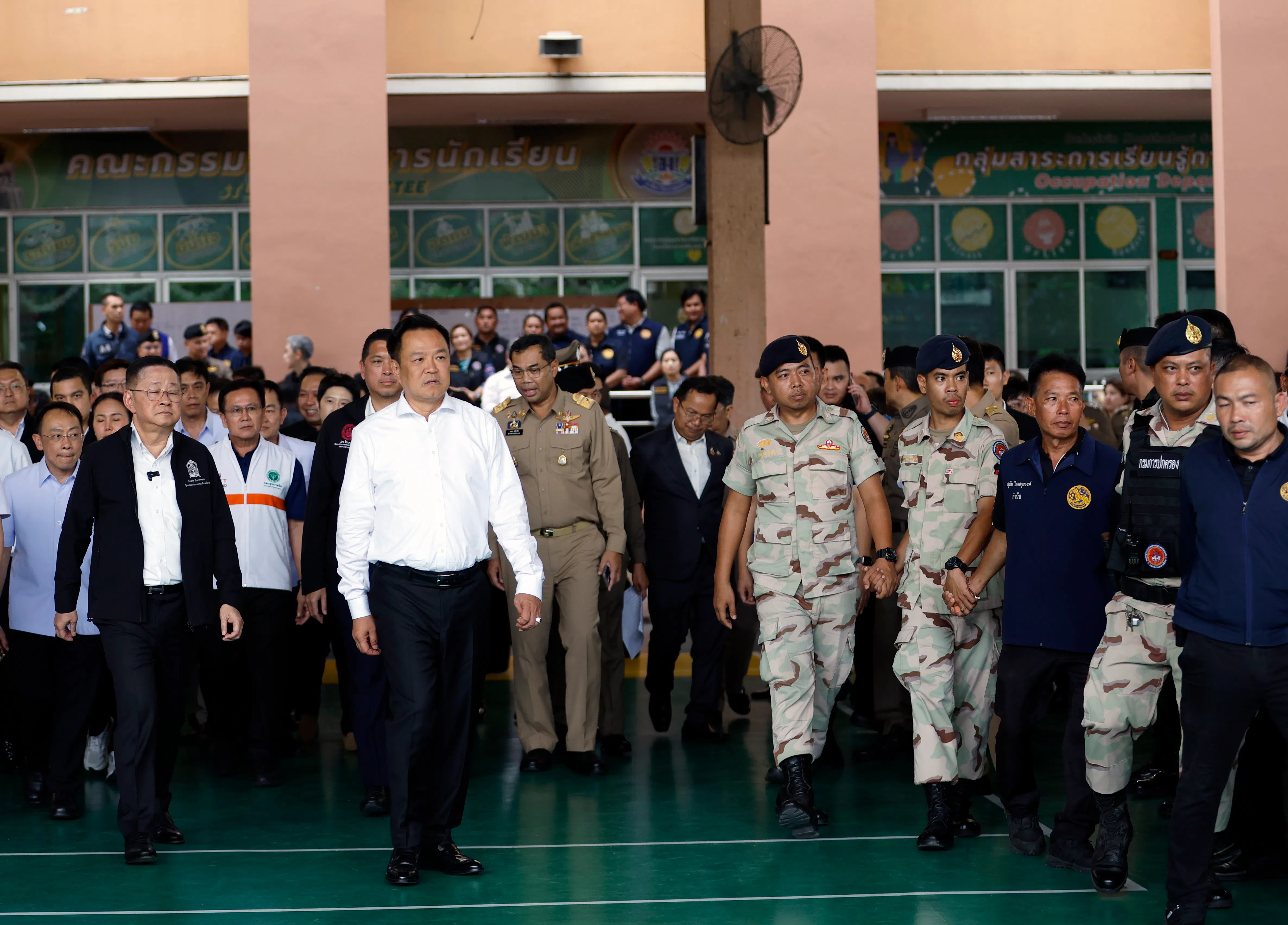 Thailand Prime Minister Anutin Charnvirakul (in white) and Minister of Education Prasert Jantararuangtong (left) inspect the site following a school shooting at Debsirin Nonthaburi School in Bang Kruai district, Nonthaburi province, Thailand on Aug 7.