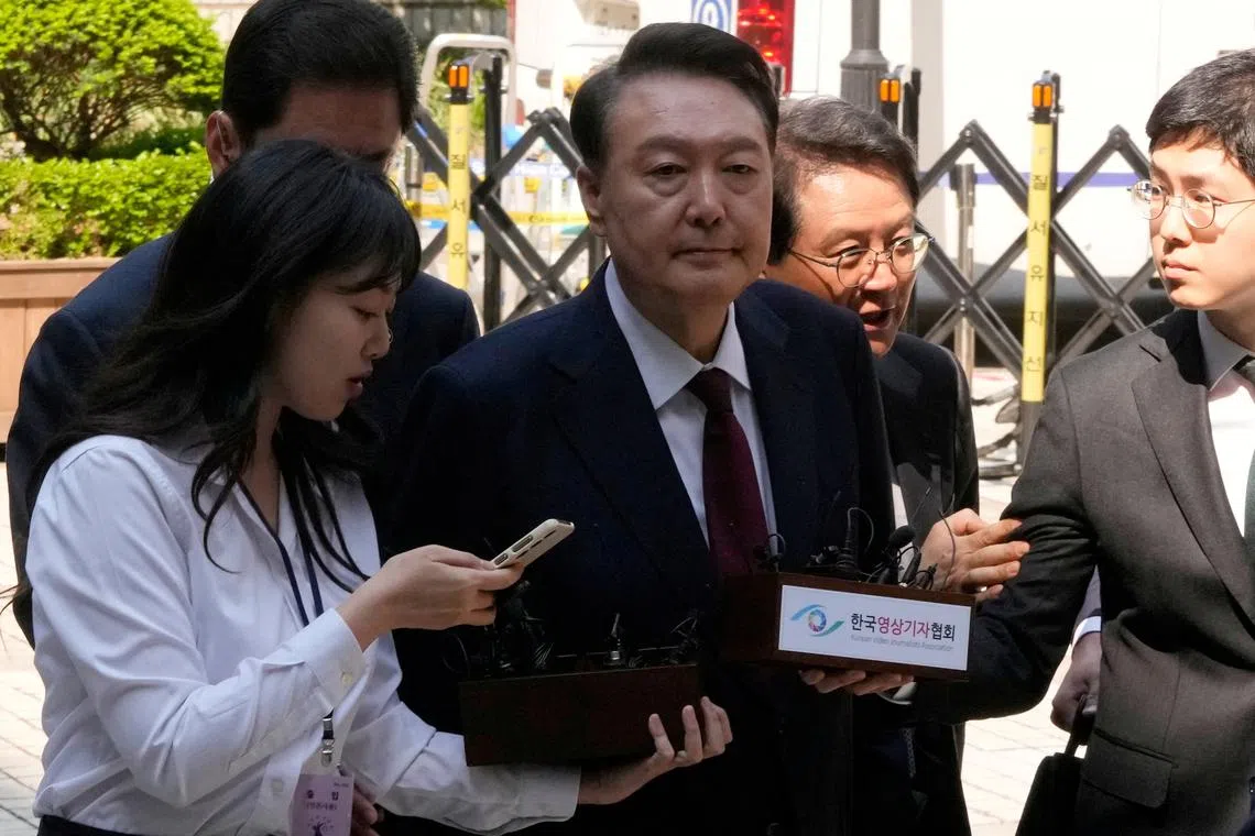 FILE PHOTO: South Korea's ousted President Yoon Suk Yeol, who is facing charges of orchestrating a rebellion when he declared martial law, arrives to attend his  trial at the Seoul Central District Court in Seoul, South Korea, Monday, May 12, 2025.     Ahn Young-joon/Pool via REUTERS/File Photo
