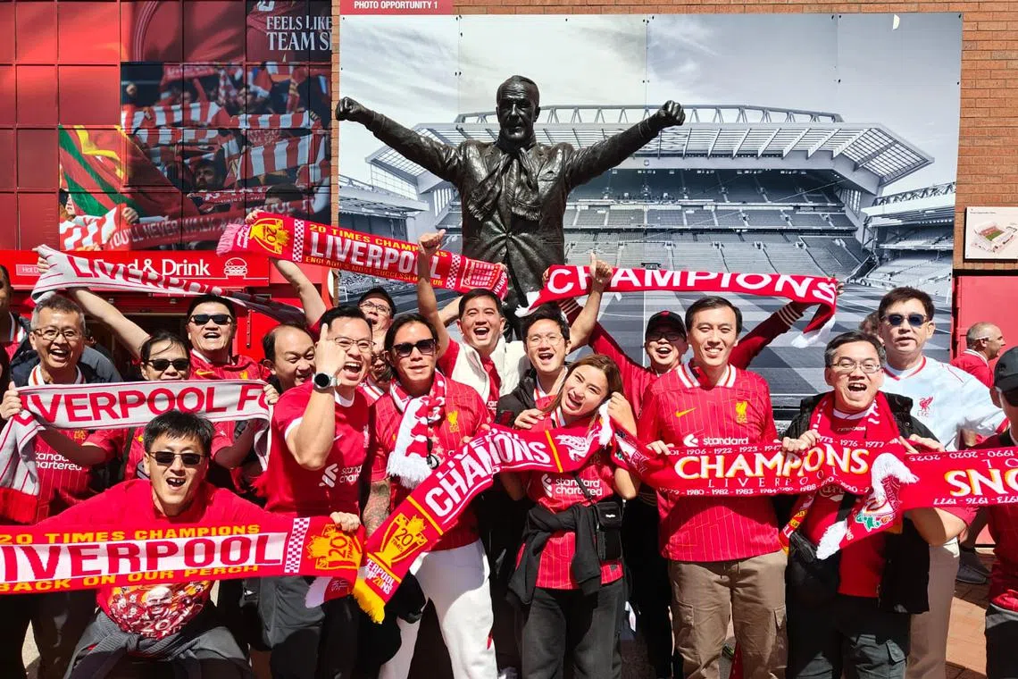 Singaporean Liverpool fan Aaron Kok (last row, with white jacket) attended the team's open-top bus parade on May 26.