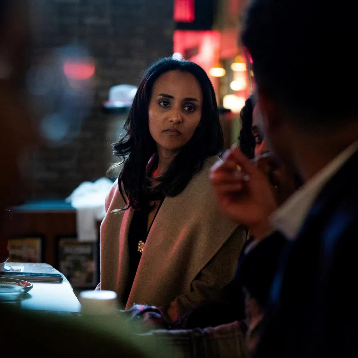 Melat Kiros, Democratic candidate for the U.S. House of Representatives from Colorado's 1st Congressional District, meets with members of Washington, D.C.'s Ethiopian diaspora during an event at Punch Bowl Social in Arlington, Virginia, U.S., March 15, 2026. REUTERS/Elizabeth Frantz