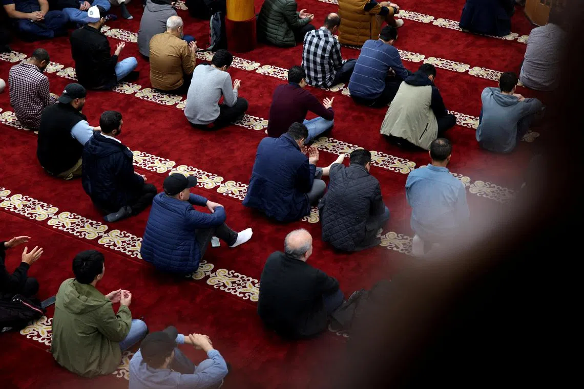Muslims attend Friday prayers at a mosque in Berlin.