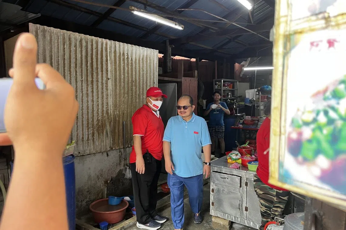 Pakatan Harapan’s candidate Shamsul Iskanda visits voters at a Chinese fishing village in Bagan Datuk, Perak.