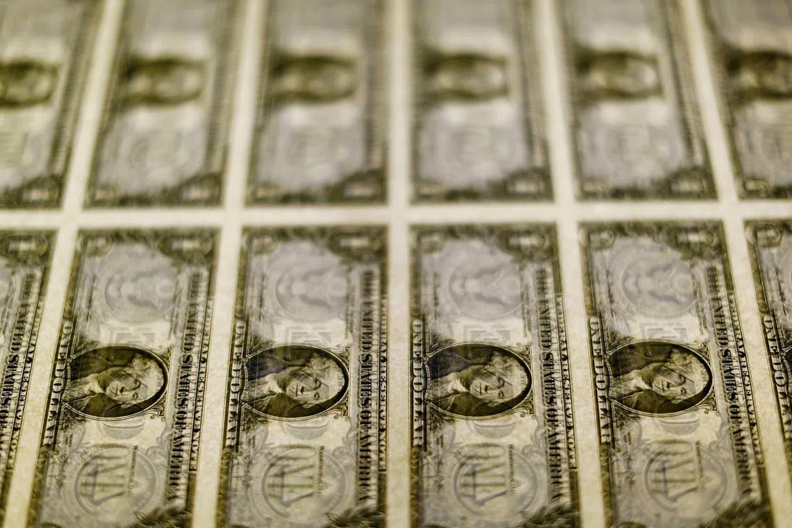 FILE PHOTO: U.S. dollar bills are seen on a light table at the Bureau of Engraving and Printing in Washington, November 14, 2014. REUTERS/Gary Cameron/File Photo
