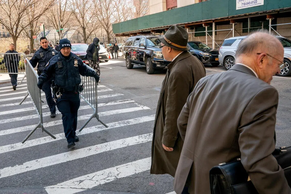 Police officers set up barricades outside Manhattan criminal court as Manhattan District Attorney Alvin Bragg continues his investigation into former US president Donald Trump on Monday. 