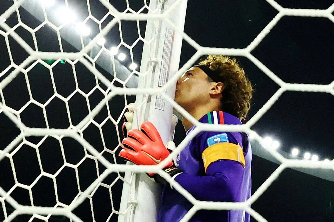Soccer Football - FIFA World Cup 2026 - Group A - Czech Republic v Mexico - Estadio Azteca, Mexico City, Mexico - June 24, 2026 Mexico's Guillermo Ochoa kisses the post as he celebrates after the match REUTERS/Annegret Hilse