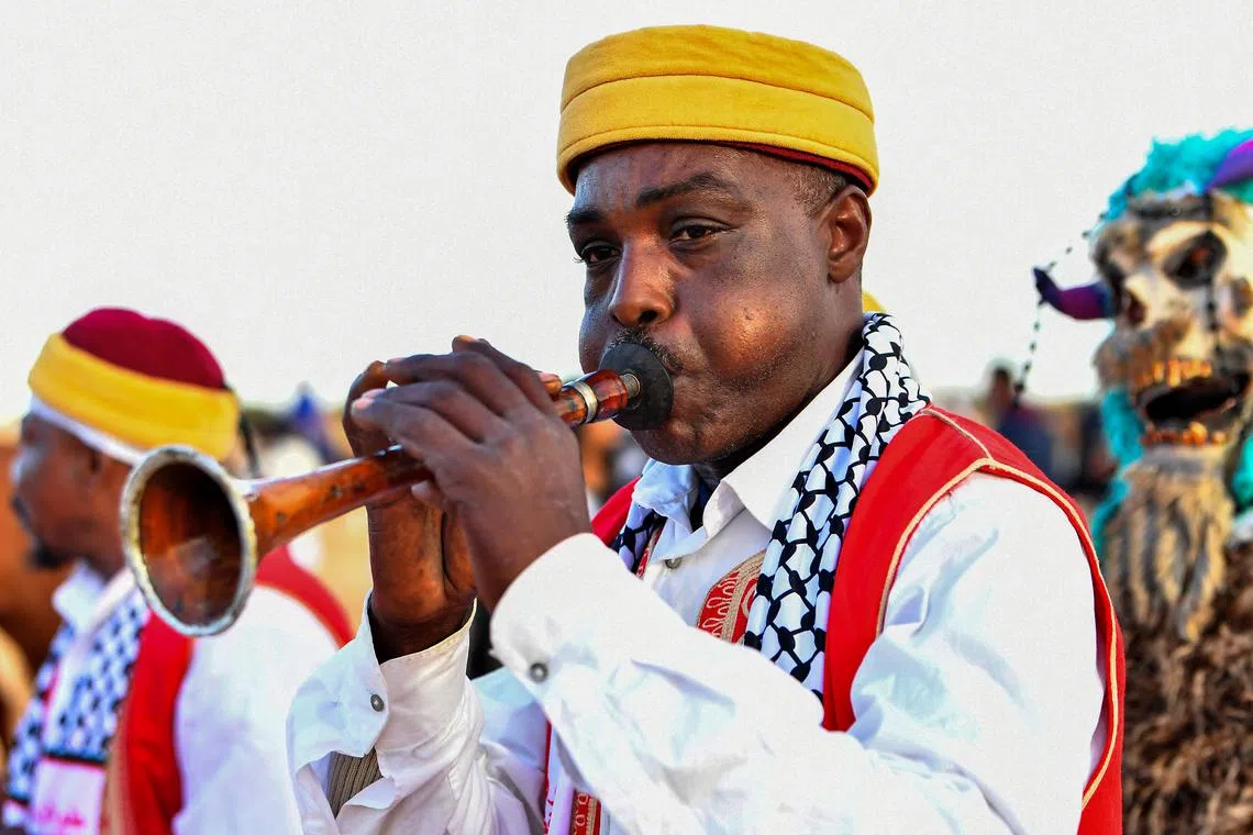 A musician performing folkloric songs during a show at the start of the International Sahara Festival on December 27, 2023 in Douz, in southern Tunisia. 