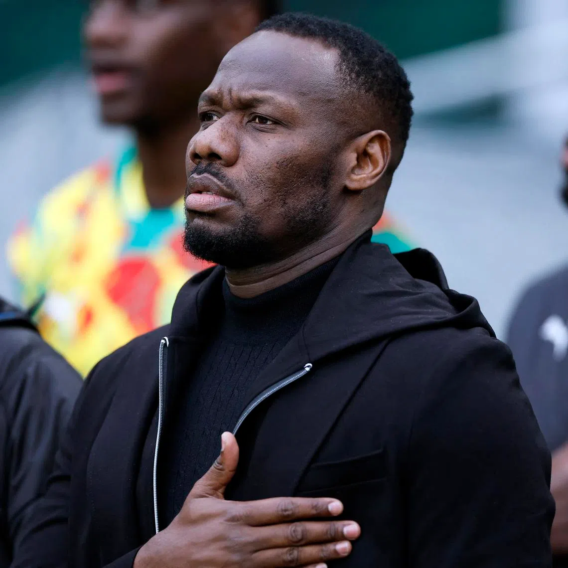 Soccer Football - International Friendly - Republic of Ireland v Senegal - Aviva Stadium, Dublin, Ireland - June 6, 2025 Senegal coach Pape Bouna Thiaw during the national anthems before the match REUTERS/Clodagh Kilcoyne/File Photo