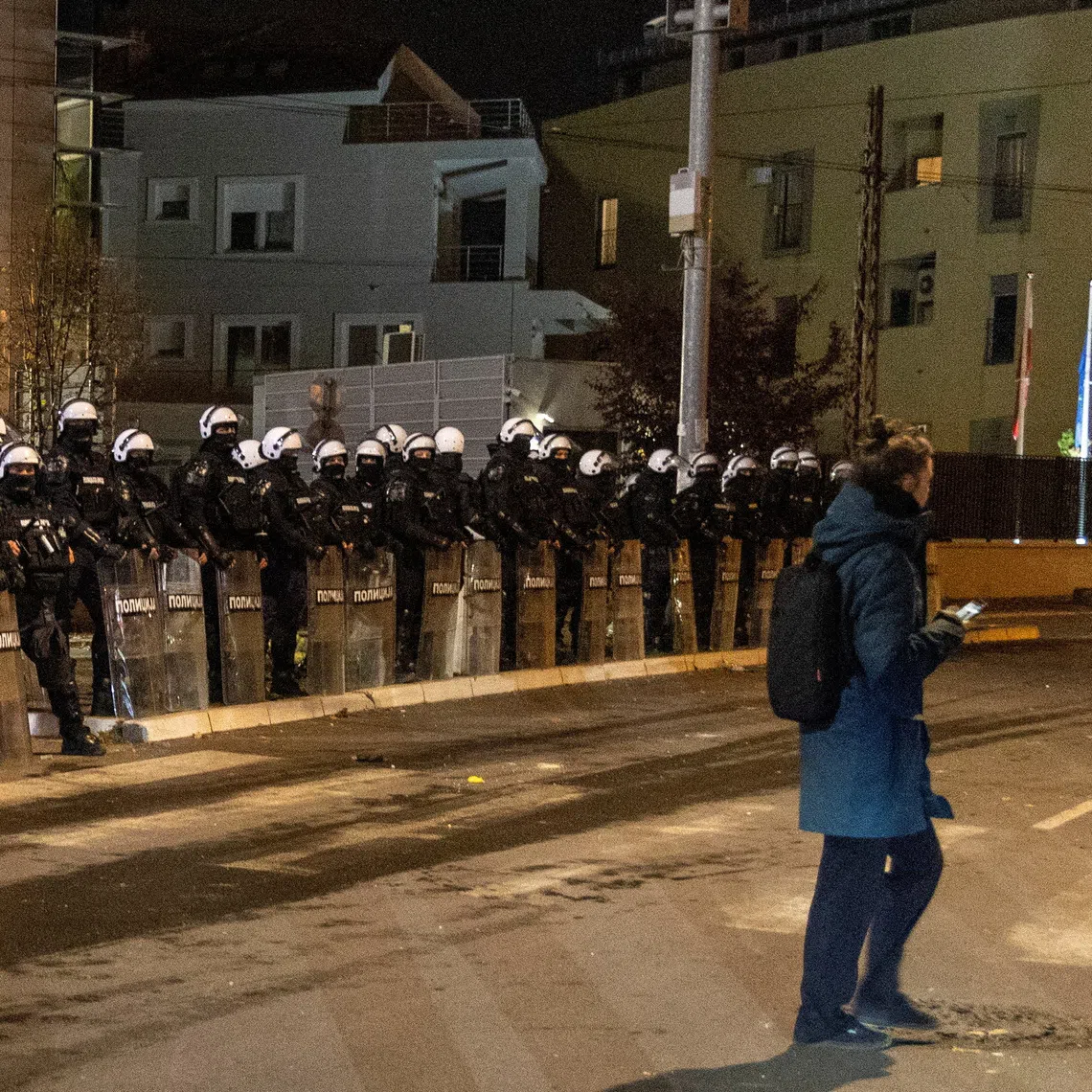 Riot police officers stand guard in front of the TV Pink building in Belgrade, Serbia, October 26, 2026. REUTERS/Djordje Kojadinovic