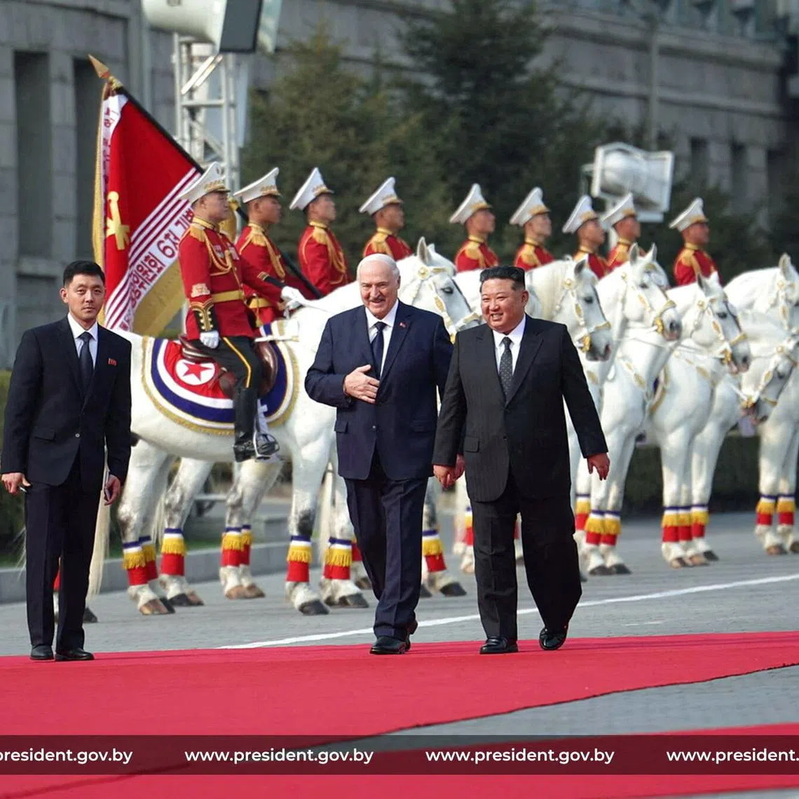 Belarusian President Alexander Lukashenko and North Korean leader Kim Jong Un walk during a meeting in Pyongyang, North Korea March 25, 2026. President of the Republic of Belarus/Handout via REUTERS