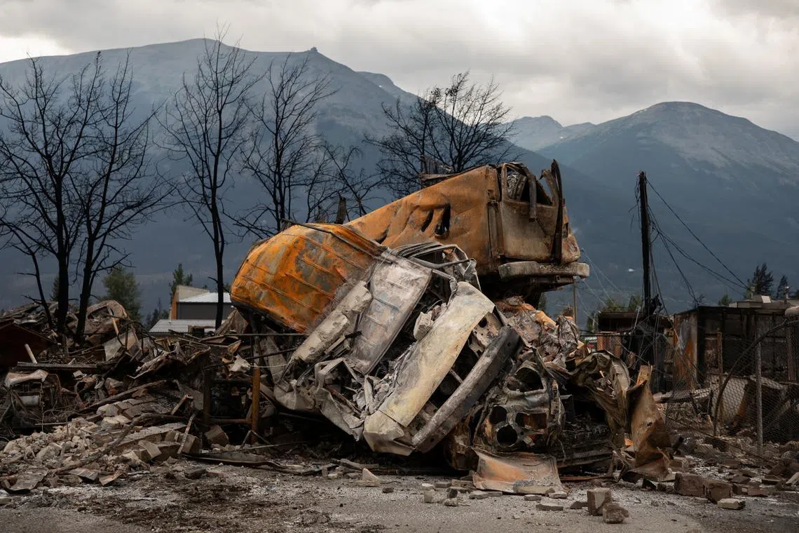 A small pile of burnt cars in Jasper, Alberta, Canada, on Friday July 26, 2024. AMBER BRACKEN/Pool via REUTERS