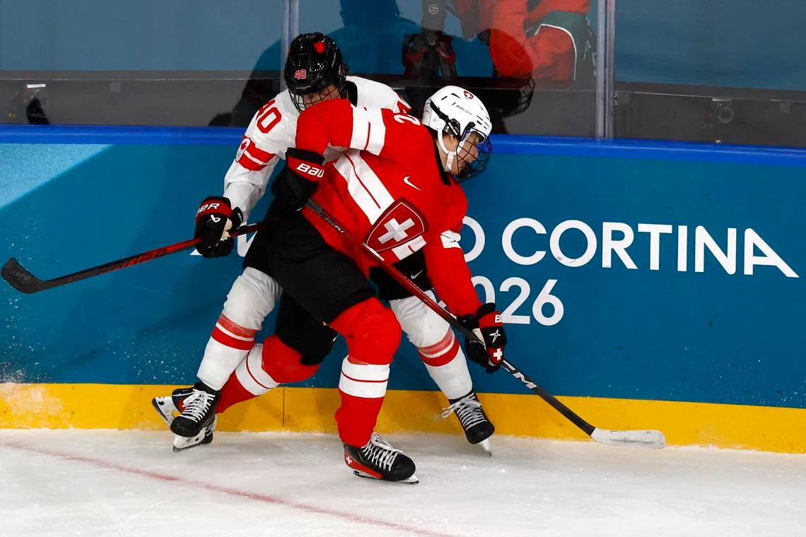 Milano Cortina 2026 Olympics - Ice Hockey - Women's Preliminary Round - Group A - Switzerland vs Canada - Milano Rho Ice Hockey Arena, Milan, Italy - February 07, 2026. Blayre Turnbull of Canada in action with Alessia Baechler of Switzerland REUTERS/Alessandro Garofalo