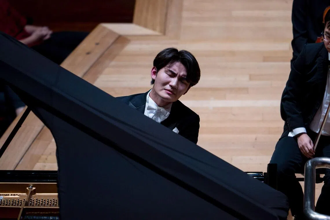 Pianist Niu Niu at the Esplanade Concert Hall on Oct 27 where he played eight concertos and tried his hand at playing the violin too.