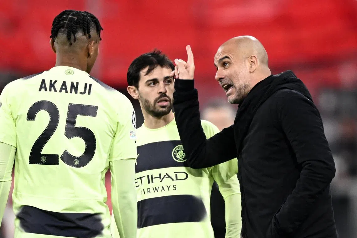 Manchester City manager Pep Guardiola talking to Bernardo Silva and Manuel Akanji during their Champions League clash against Bayern Munich.