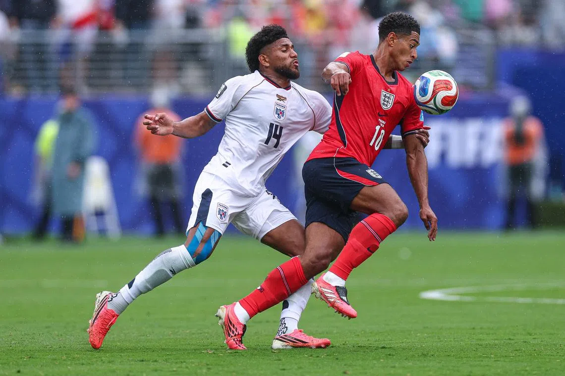 Jun 27, 2026; East Rutherford, New Jersey, USA; England midfielder Jude Bellingham (10) and Panama midfielder Carlos Harvey (14) in action during a Group L match of the 2026 FIFA World Cup at New York New Jersey Stadium. Mandatory Credit: Vincent Carchietta-Imagn Images
