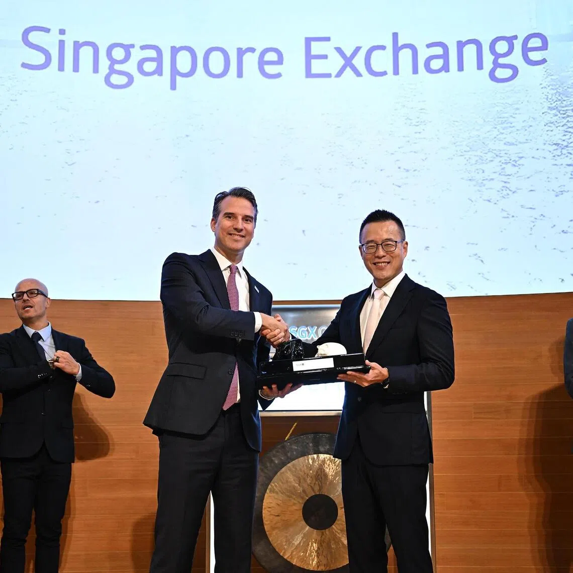 tgavepoint19 - Mr Pol de Win, senior managing director and head of global sales and origination at SGX Group (left), presenting a token of appreciation to Dr Tianyi Jiang, chief executive of AvePoint, at the company’s secondary listing ceremony on the Singapore Exchange on Sept 19, 2025.  

Credit: SGX