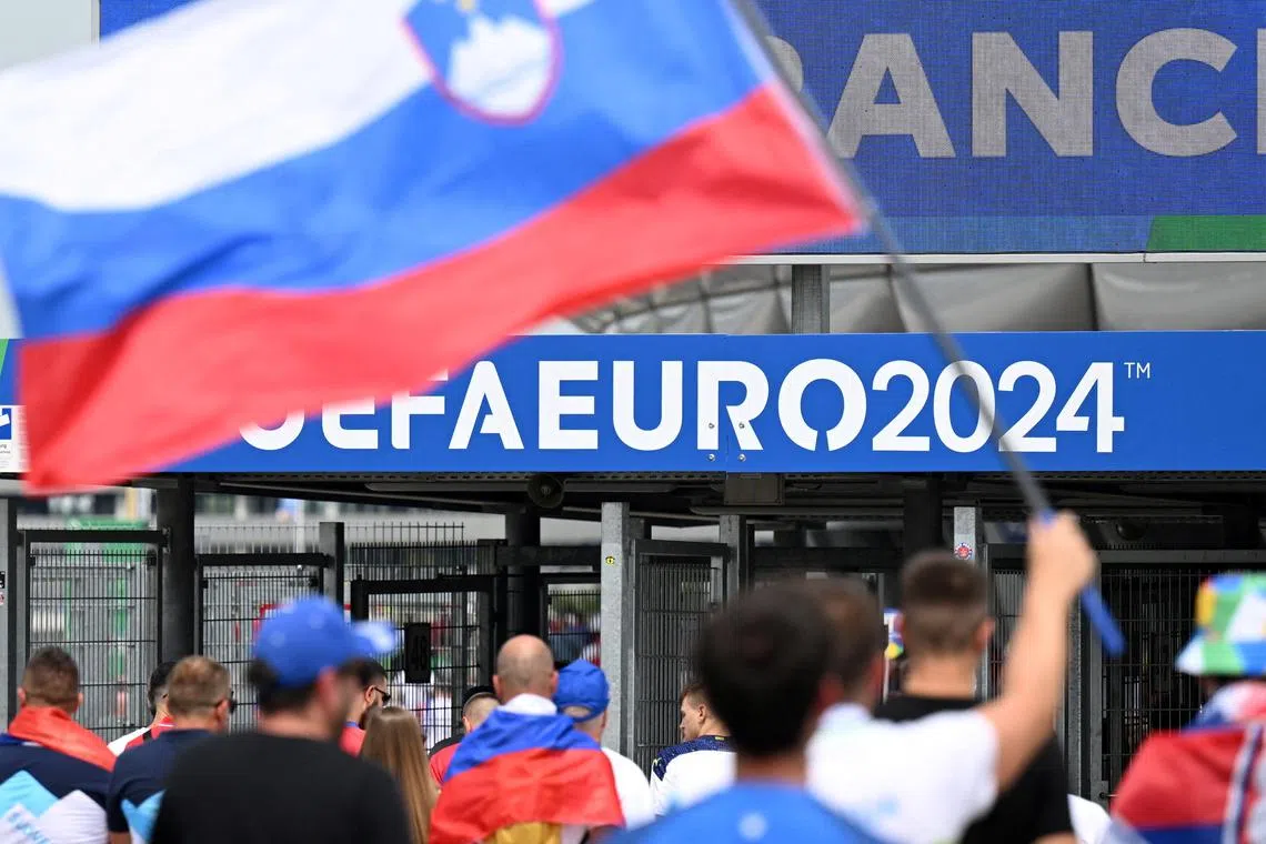 FILE PHOTO: Soccer Football - Euro 2024 - Group C - Slovenia v Serbia - Munich Football Arena, Munich, Germany - June 20, 2024  Slovenia fans walk into the stadium before the match REUTERS/Angelika Warmuth/File Photo